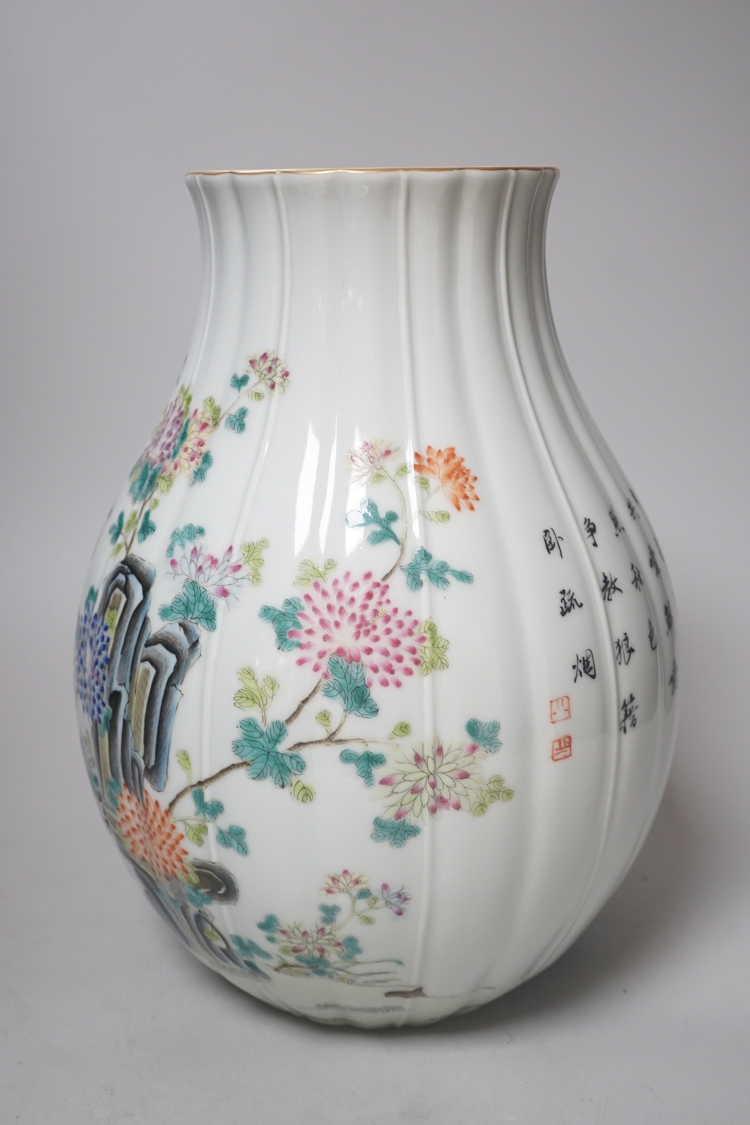 A Chinese famille rose lobed baluster vase, Qianlong seal mark but later. 30cm tall